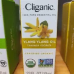 A display of Cliganic Essential Oils, including Ylang Ylang, available at The WOW Center in Missouri Valley.