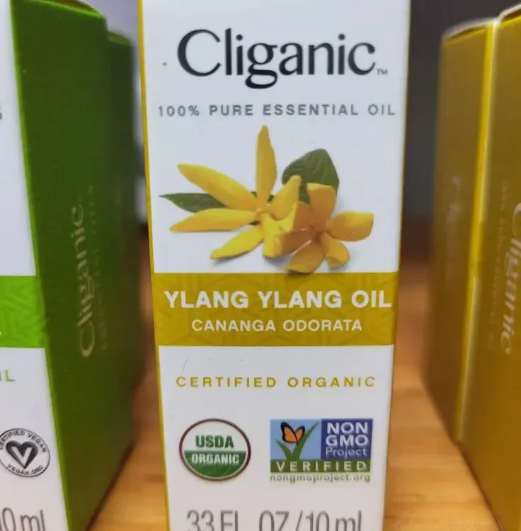 A display of Cliganic Essential Oils, including Ylang Ylang, available at The WOW Center in Missouri Valley.