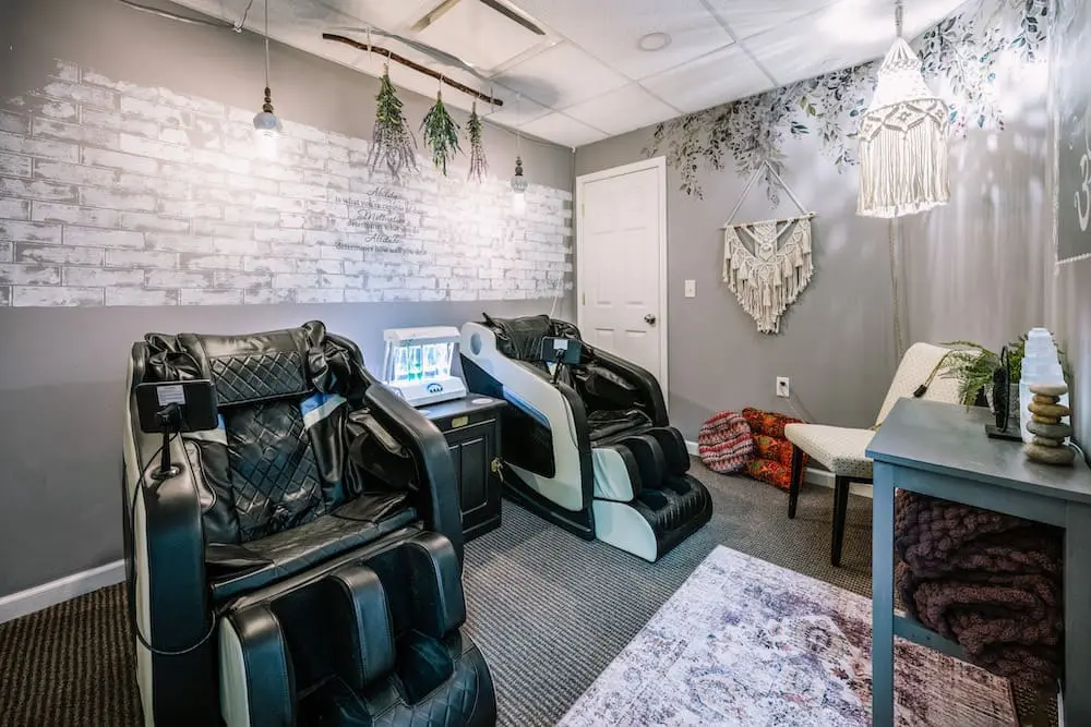 Oxygen bar station featuring four scents and full-body heated zero-gravity massage chairs.